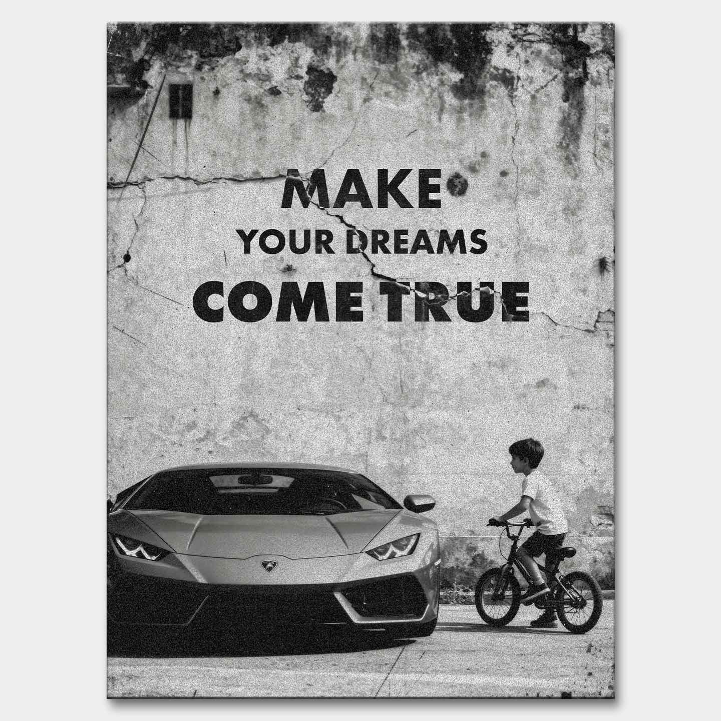 Obraz motywacyjny na płótnie „Make Your Dreams Come True” – czarno-biała scena z Lamborghini i chłopcem na rowerze, z napisem motywacyjnym.