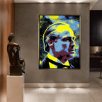 Obraz na płótnie Godfather w stylu pop-art z wizerunkiem Ojca Chrzestnego w intensywnych kolorach żółci, błękitu i czerni.