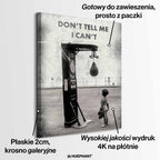 Motywacyjny obraz na płótnie Don’t Tell Me I Can’t – dziecko w rękawicach bokserskich patrzące na worek treningowy, symbol odwagi i determinacji.