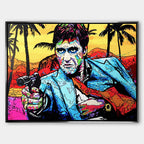 Nowoczesny obraz na płótnie w stylu pop-art przedstawiający portret mężczyzny z pistoletem na tle palm. Kolorowy wydruk galeryjny od Huephant, edycja limitowana