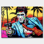 Nowoczesny obraz na płótnie w stylu pop-art przedstawiający portret mężczyzny z pistoletem na tle palm. Kolorowy wydruk galeryjny od Huephant, edycja limitowana