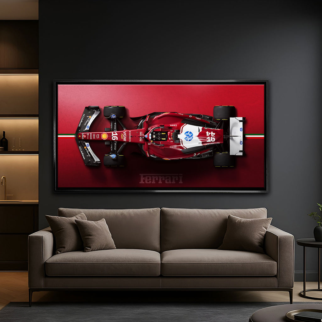 Obraz na płótnie F1 Ferrari – czerwony bolid Formuły 1 z widoku z góry, symbol luksusu, prędkości i determinacji, idealny do wnętrz pełnych energii.