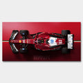 Obraz na płótnie F1 Ferrari – czerwony bolid Formuły 1 z widoku z góry, symbol luksusu, prędkości i determinacji, idealny do wnętrz pełnych energii.
