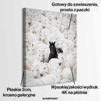 Obraz na płótnie „The Black Horse” – czarny koń wyróżniający się spośród białych koni, symbol odwagi, siły i indywidualizmu.