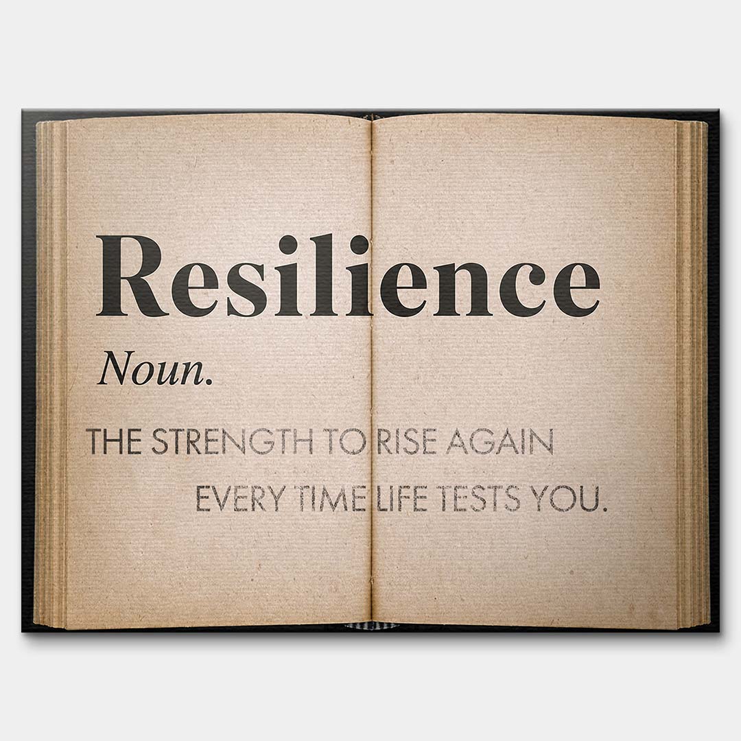 Motywacyjny obraz na płótnie Definition Of Resilience przedstawiający definicję odporności psychicznej na stronach starej książki, wydruk galeryjny.