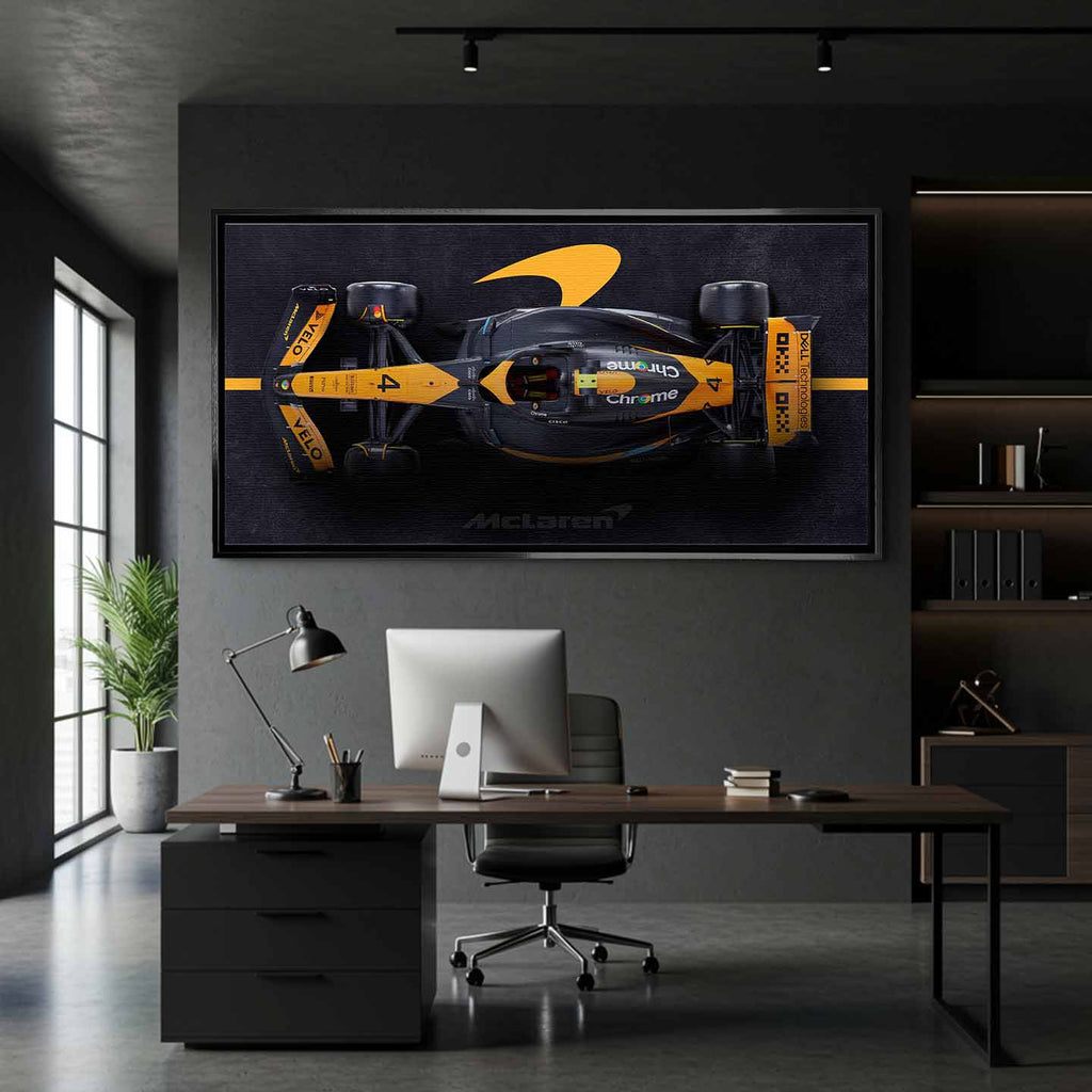 obraz na płótnie f1 mclaren bolid z lotu ptaka pomarańczowo czarny motorsport