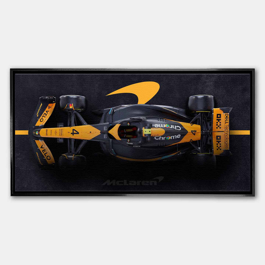 obraz na płótnie f1 mclaren bolid z lotu ptaka pomarańczowo czarny motorsport