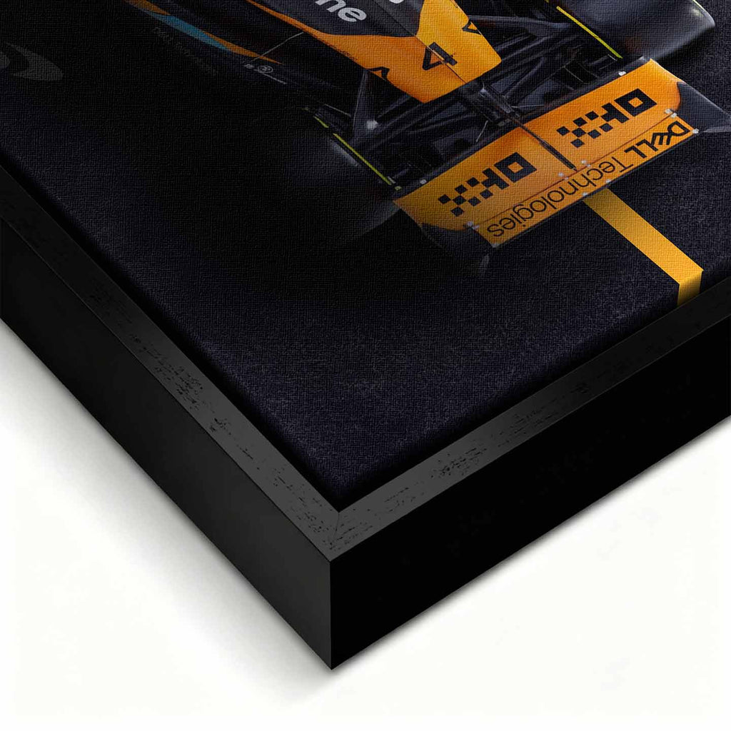 obraz na płótnie f1 mclaren bolid z lotu ptaka pomarańczowo czarny motorsport