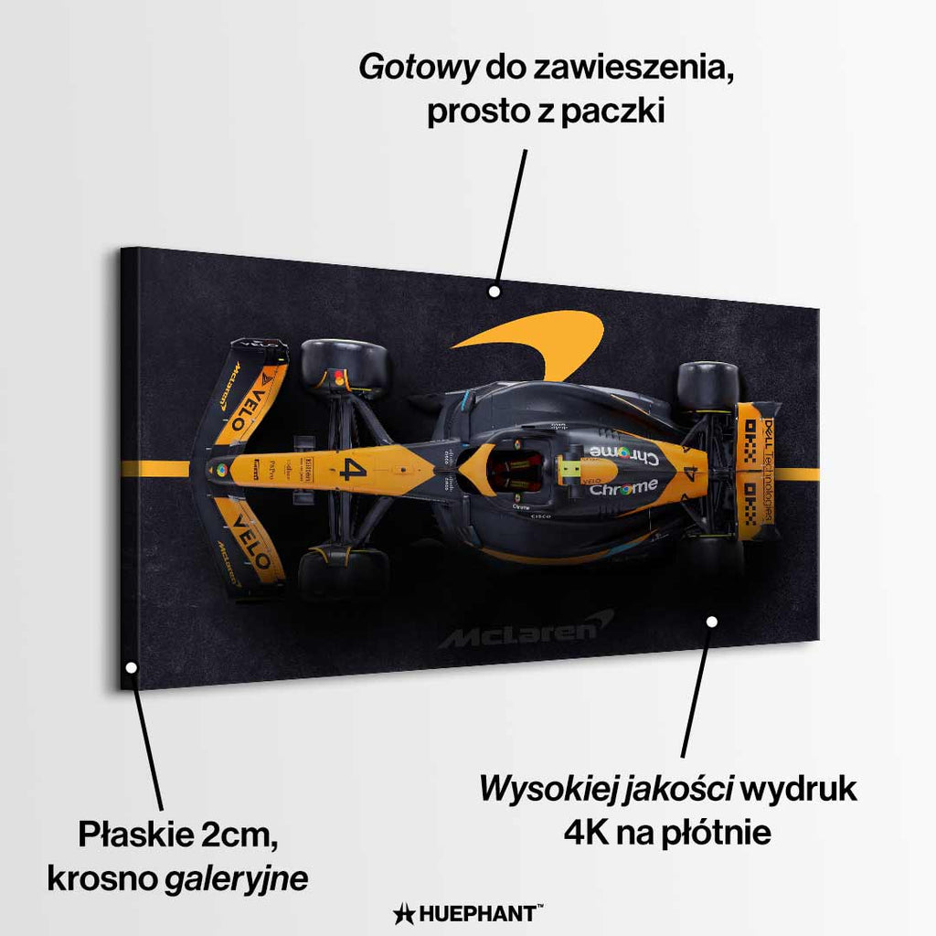 obraz na płótnie f1 mclaren bolid z lotu ptaka pomarańczowo czarny motorsport