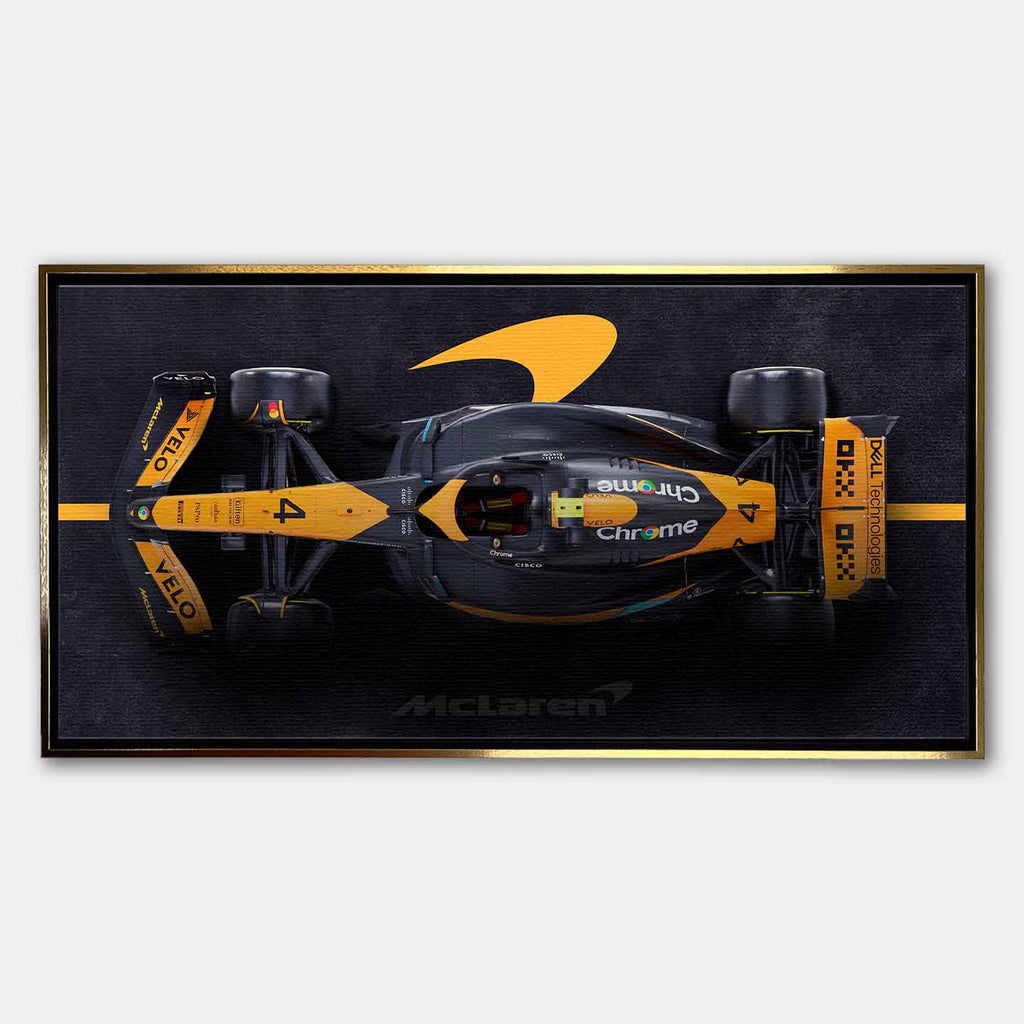 obraz na płótnie f1 mclaren bolid z lotu ptaka pomarańczowo czarny motorsport
