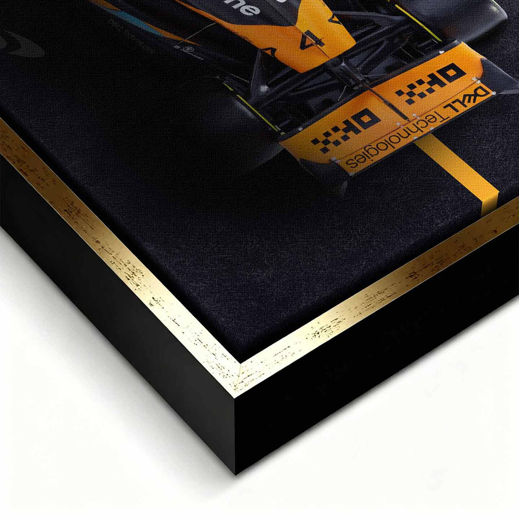 obraz na płótnie f1 mclaren bolid z lotu ptaka pomarańczowo czarny motorsport