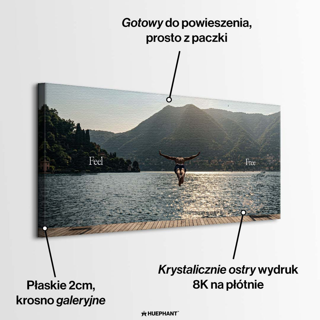 Mężczyzna skaczący do jeziora na tle gór z napisem Feel Free, obraz na płótnie, wydruk galeryjny.