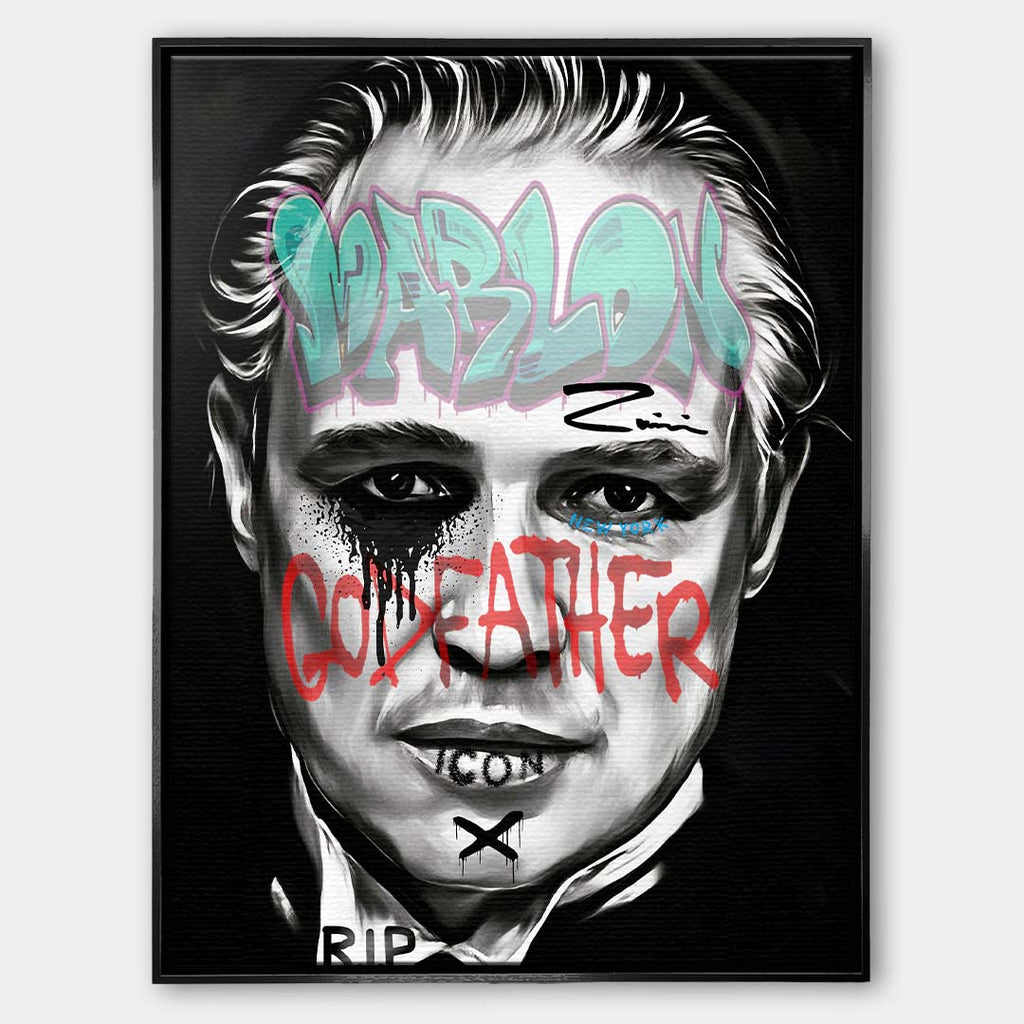 Czarno-biały obraz na płótnie Marlon Brando z filmu Ojciec Chrzestny. Wydruk galeryjny pop art z niebieskim napisem Marlon i czerwonym tekstem Godfather.