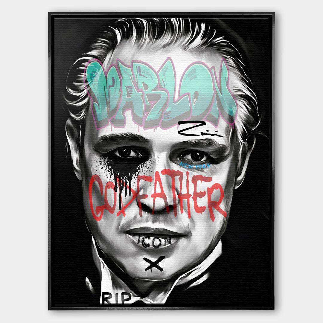 Czarno-biały obraz na płótnie Marlon Brando z filmu Ojciec Chrzestny. Wydruk galeryjny pop art z niebieskim napisem Marlon i czerwonym tekstem Godfather.