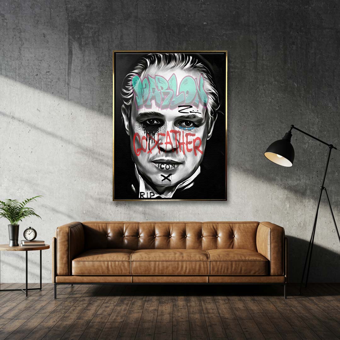 Czarno-biały obraz na płótnie Marlon Brando z filmu Ojciec Chrzestny. Wydruk galeryjny pop art z niebieskim napisem Marlon i czerwonym tekstem Godfather.