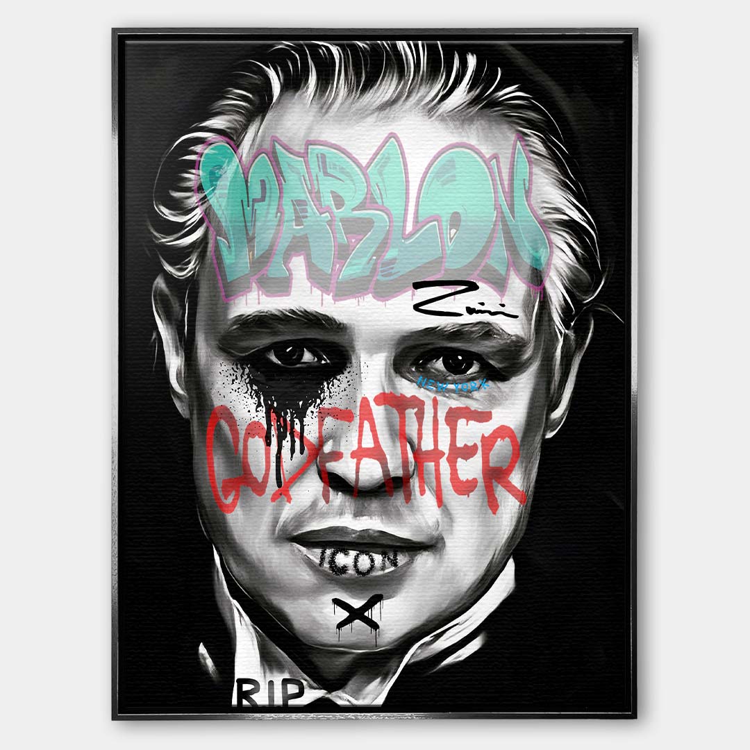 Czarno-biały obraz na płótnie Marlon Brando z filmu Ojciec Chrzestny. Wydruk galeryjny pop art z niebieskim napisem Marlon i czerwonym tekstem Godfather.