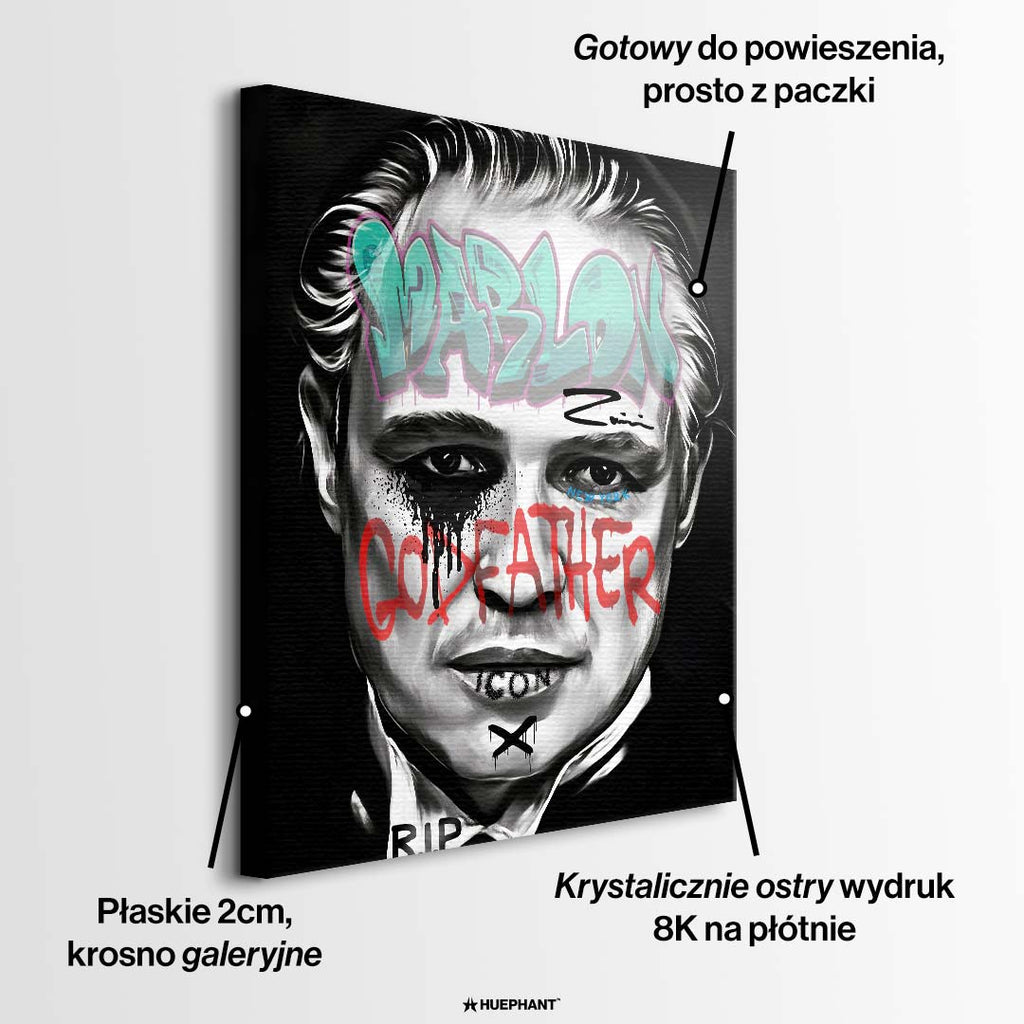 Czarno-biały obraz na płótnie Marlon Brando z filmu Ojciec Chrzestny. Wydruk galeryjny pop art z niebieskim napisem Marlon i czerwonym tekstem Godfather.