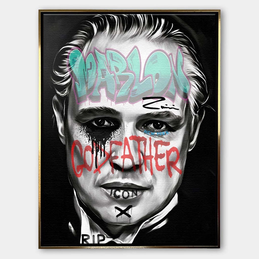 Czarno-biały obraz na płótnie Marlon Brando z filmu Ojciec Chrzestny. Wydruk galeryjny pop art z niebieskim napisem Marlon i czerwonym tekstem Godfather.