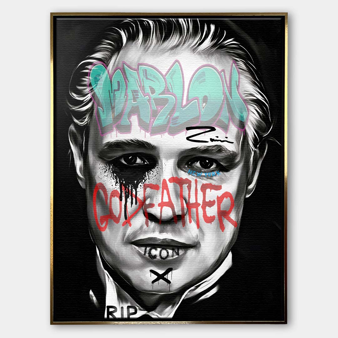 Czarno-biały obraz na płótnie Marlon Brando z filmu Ojciec Chrzestny. Wydruk galeryjny pop art z niebieskim napisem Marlon i czerwonym tekstem Godfather.
