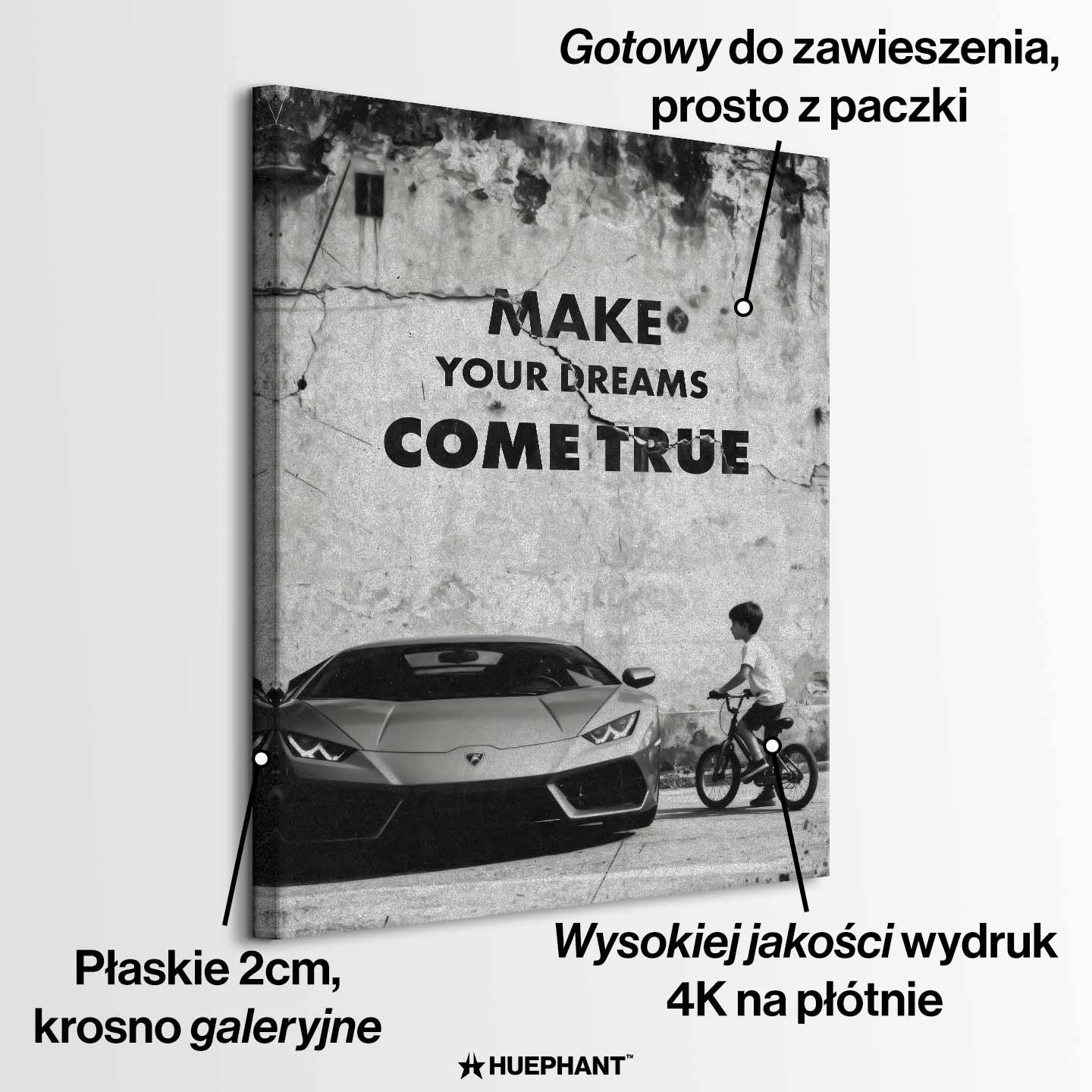 Obraz motywacyjny na płótnie „Make Your Dreams Come True” – czarno-biała scena z Lamborghini i chłopcem na rowerze, z napisem motywacyjnym.