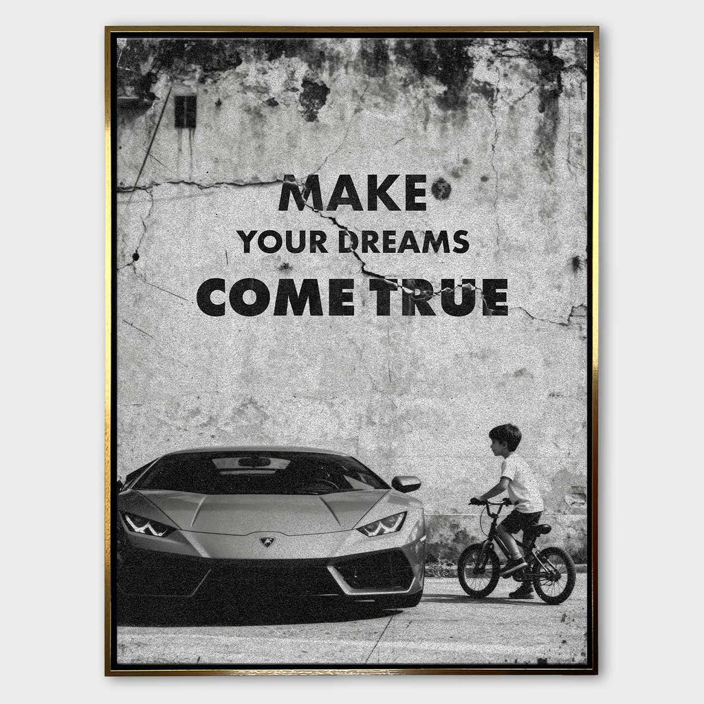 Obraz motywacyjny na płótnie „Make Your Dreams Come True” – czarno-biała scena z Lamborghini i chłopcem na rowerze, z napisem motywacyjnym.