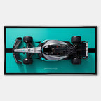 obraz na płótnie f1 mercedes amg petronas bolid z lotu ptaka turkus czarny motorsport