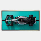 obraz na płótnie f1 mercedes amg petronas bolid z lotu ptaka turkus czarny motorsport