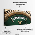 Luksusowy poziomy obraz na płótnie rollie-everyday przedstawiający złotą koronę i napis EVERYDAY na głębokim zielonym tle tarczy zegarka.