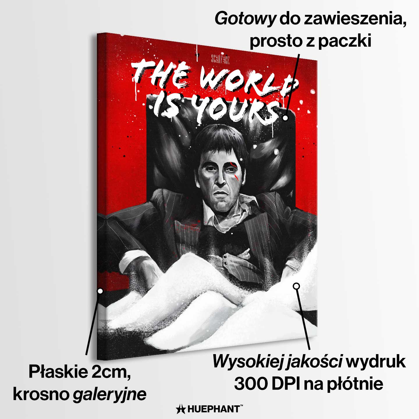 Obraz na płótnie przedstawiający Tony'ego Montanę z filmu „Scarface”, siedzącego na czarnym fotelu na tle czerwonego tła z białym napisem „The World Is Yours”; intensywna scena w czarno-białej kolorystyce z kontrastującymi elementami czerwieni i bieli.