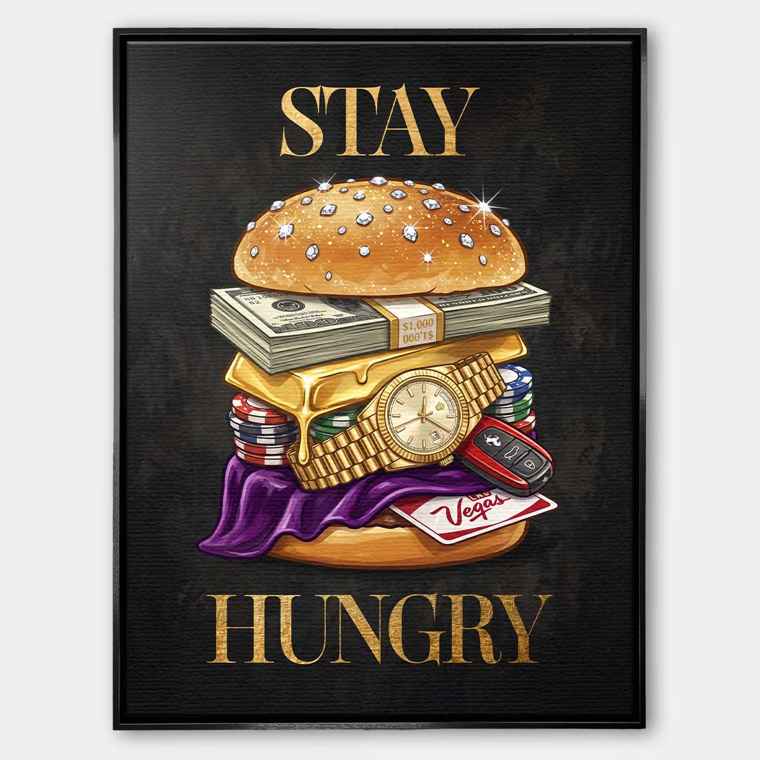 Nowoczesny obraz na płótnie przedstawiający burgera z banknotów, złota i zegarka oraz złoty napis STAY HUNGRY na czarnym tle. Wydruk galeryjny Huephant.