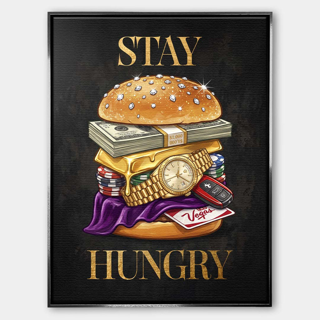 Nowoczesny obraz na płótnie przedstawiający burgera z banknotów, złota i zegarka oraz złoty napis STAY HUNGRY na czarnym tle. Wydruk galeryjny Huephant.