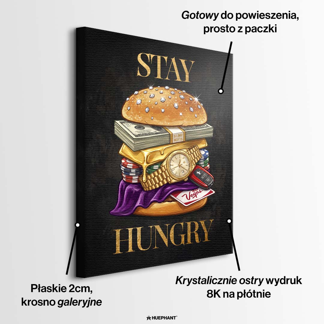 Nowoczesny obraz na płótnie przedstawiający burgera z banknotów, złota i zegarka oraz złoty napis STAY HUNGRY na czarnym tle. Wydruk galeryjny Huephant.